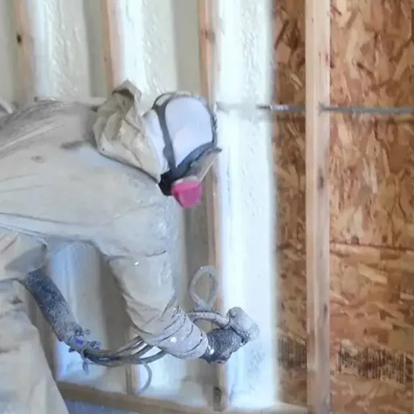 Sunny South Inc employee spraying foam in walls