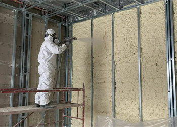 Sunny South Inc employee spraying foam insulation