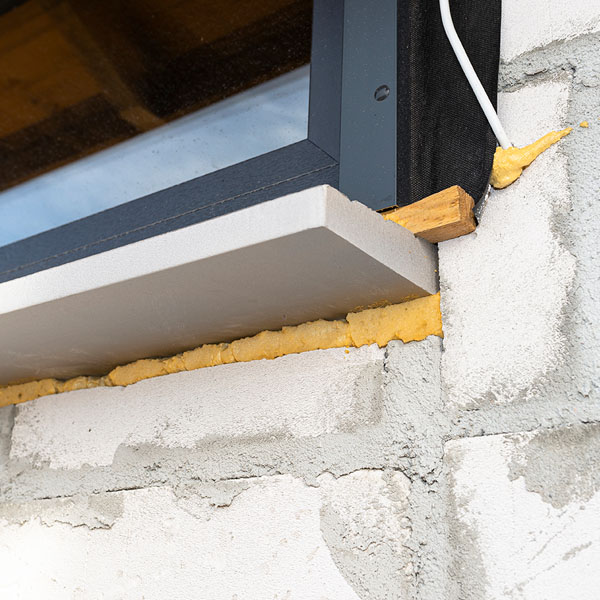 spray foam out side of windows to seal it