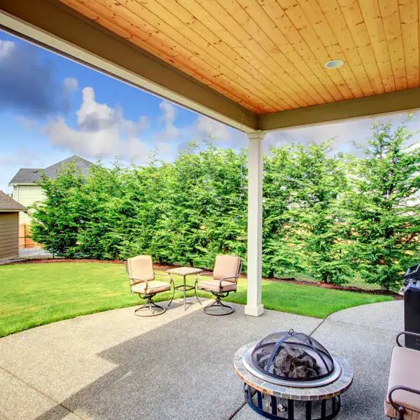 Outdoor patio area with seating and decorative landscaping in Calgary, AB