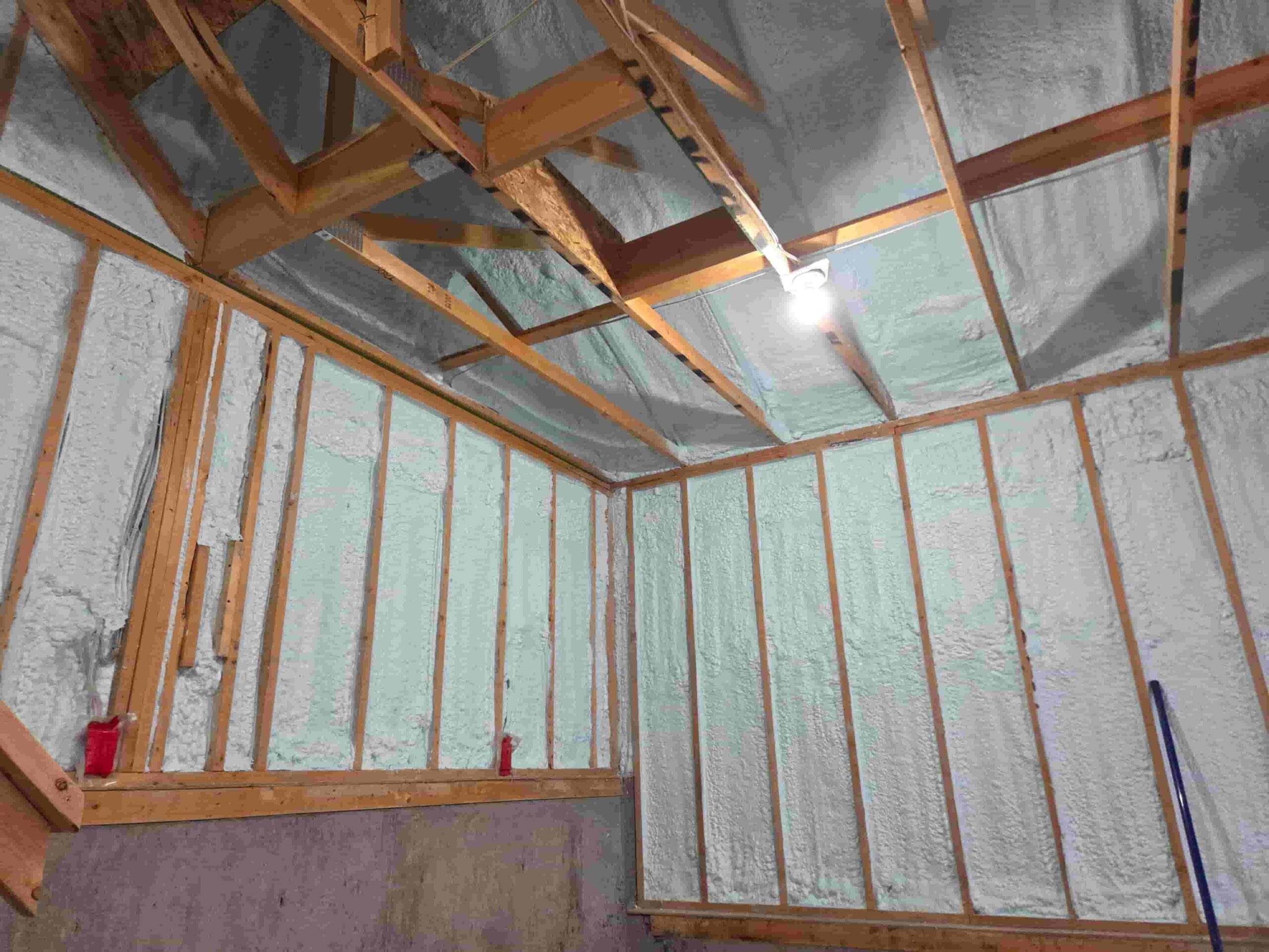 Interior under construction with spray foam insulation on walls in Calgary, AB